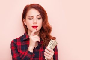 young woman considering how to wisely conserve her cash